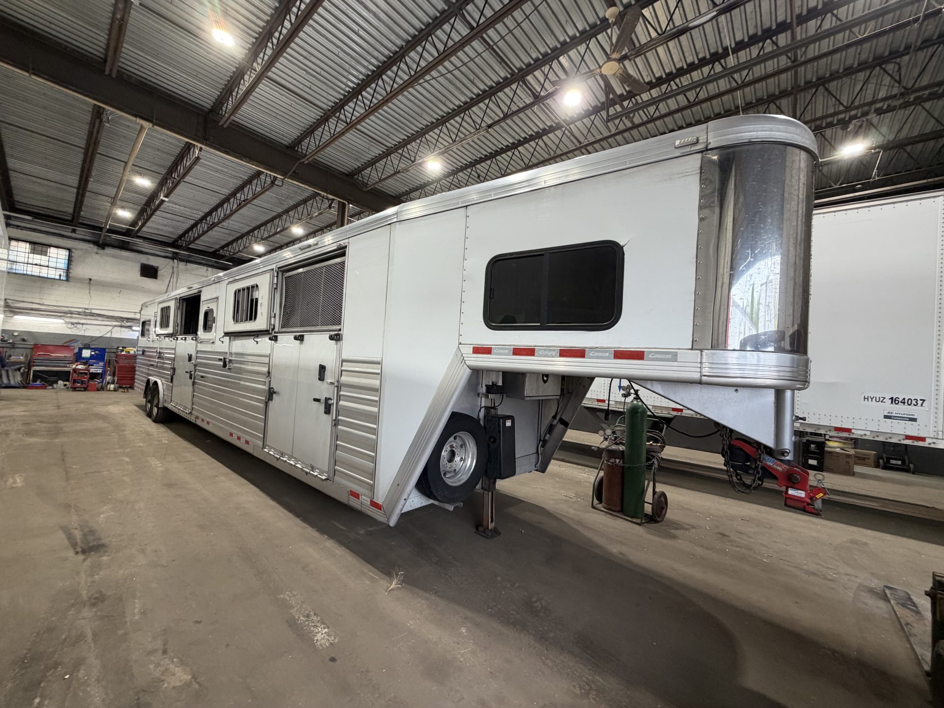 Horse trailer in Atlantic Trailer's repair shop